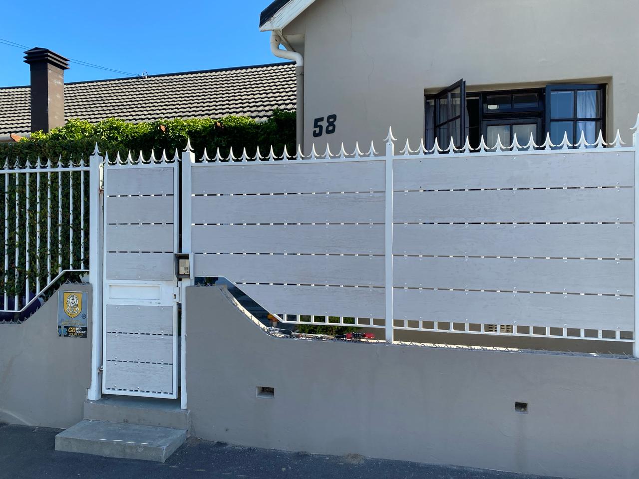 Nutec-clad pedestrian gate and fencing with white palisade toppers, Somerset West